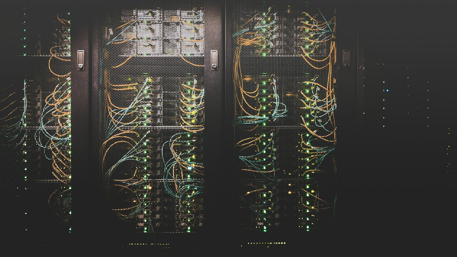 Server racks with cabling representing cloud backup for Monterey businesses